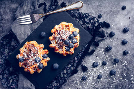 Waffles with blueberries and chocolateの写真素材