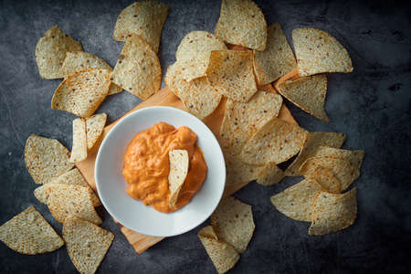 Mexican nachos with cheese sauce.の写真素材
