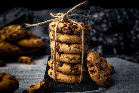 Close-up of handmade chocolate cookie tower tied with rope. Cooking backgroundの写真素材