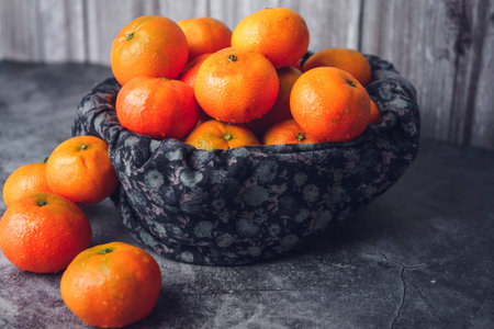 Tangerine basket close-up. Front view
