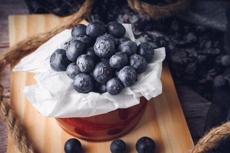 Still life of strawberry and blueberries. Dark food. Sweet dessert.