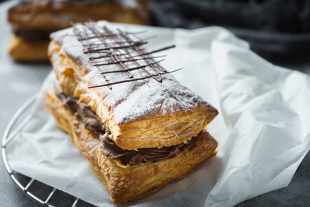 Puff pastry with confectioner's sugar and chocolate filling