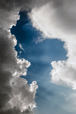 Sun rays through the cloudsの写真素材