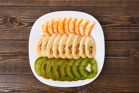 Slices of fresh fruit on a saucerの写真素材