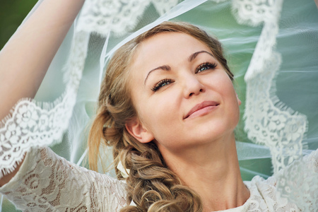 Young bride holding a veilの写真素材