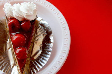 Cherry cake on red background 