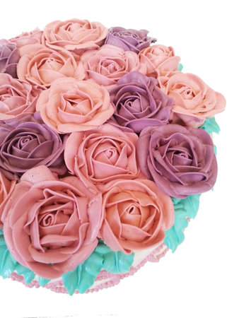 colorful creamed roses decorates on cakeの写真素材