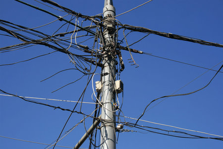Post and very many the confused electric wires on it