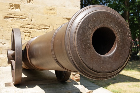 Old cannon on wheels about a fortificationの写真素材