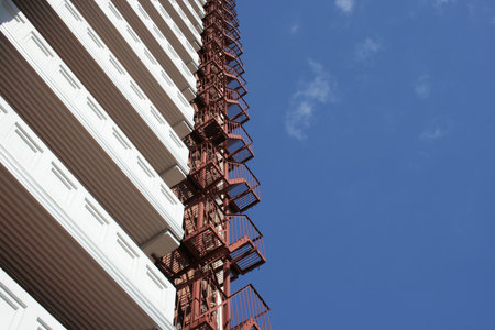 The bottom view on a fire-escape of the many-storeyed house