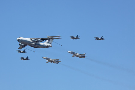 MOSCOW - MAY 9: Military parade of 65th anniversaries of a victory devoted to celebrating in WWII, on May 9, 2010 in Moscow. The plane of tanker accompanied by group of fighters in the sky over Moscow flies up to Red Square.のeditorial素材