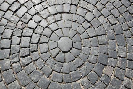 The roadway paved by a grey granite, backgroundの写真素材