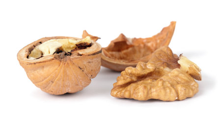 Cracked walnut, isolated on a white background
