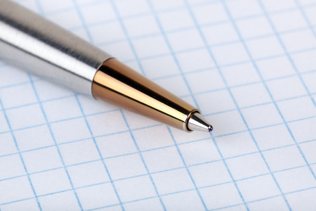 Ballpoint pen have put on a squared paper clean sheetの写真素材
