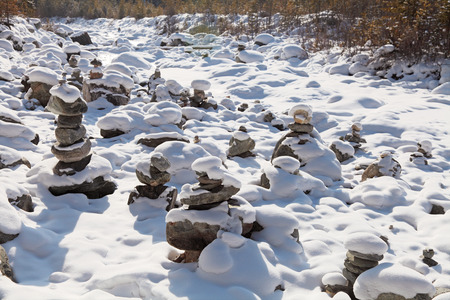 The cult of the sacred place Ovoo with the pyramids of stones, Russia, Siberia, the Republic of Buryatiaの写真素材
