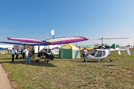 ZHUKOVSKY, RUSSIA - AUG 16: The small aircraft - trike and lightweight single seat helicopter at the...