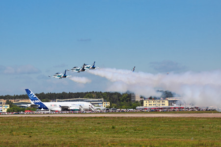 ZHUKOVSKY, RUSSIA - AUGUST 19: Àerobatic team "Rus" on L39 planes take-off at the International Aviation and Space salon (MAKS) on August 19, 2011 in Zhukovsky, Russiaのeditorial素材