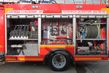 NIZHNY TAGIL, RUSSIA- AUG 23: Open side with the equipment of modern fire engine at exhibition...
