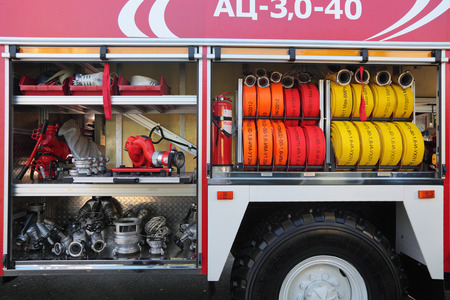 NIZHNY TAGIL, RUSSIA- AUG 23: Open side with the equipment of modern fire engine at exhibition...