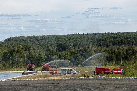NIZHNY TAGIL, RUSSIA - AUG 23: Demonstration of work of firemens at the exhibition RUSSIAN DEFENCE...