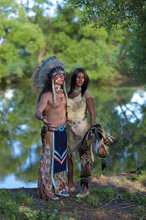 Indian chief with a young Indian on the banks of the riverの写真素材