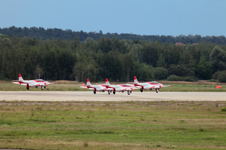 ZHUKOVSKY, RUSSIA â AUG 11: The celebrating of the 100 anniversary of Russian air force. August, 11, 2012 at Zhukovsky, Russia. Aerobatic team Iskry (White and Red Sparks) of the Polish Air Forcesのeditorial素材