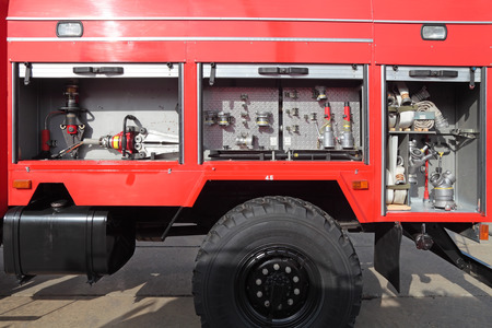 NIZHNY TAGIL, RUSSIA- AUG 23: Open side with the equipment of modern fire engine at exhibition...