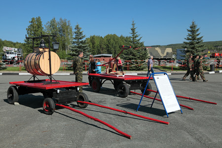 NIZHNY TAGIL, RUSSIA- AUG 22: Fire retro appliances â€” wooden barrel for the water to the cart...