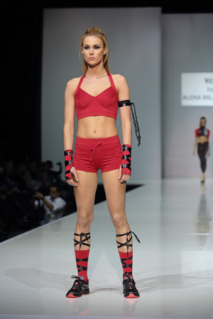 MOSCOW, RUSSIA - APR 01, 2014: Moscow Fashion Week in Gostiny Dvor. Demonstration models of clothes on the catwalk from Moscow designer Alena Milanskayaのeditorial素材