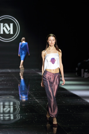 MOSCOW, RUSSIA - APR 01, 2014: Moscow Fashion Week in Gostiny Dvor. Demonstration models of clothes on the catwalk from Moscow designer Kristina Kapitanakiのeditorial素材