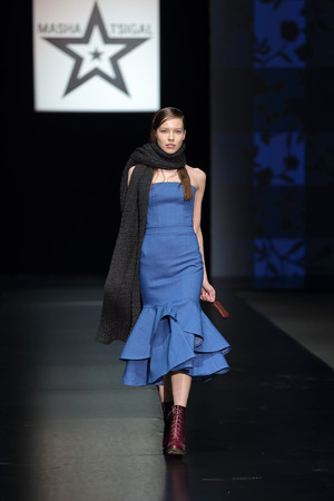 MOSCOW, RUSSIA - APR 03, 2014: Moscow Fashion Week in Gostiny Dvor. Demonstration models of clothes on the catwalk from Moscow designer Masha Tsagalのeditorial素材