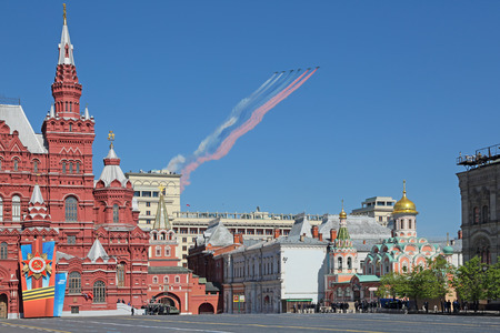 MOSCOW, RUSSIA - MAY 09, 2014: Celebration of the 69th anniversary of the Victory Day (WWII). The airshow on the Red Square, the group of planes smoke colors of the Russian flagのeditorial素材