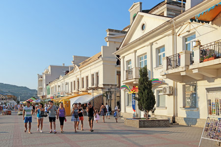 BALAKLAVA, SEVASTOPOL CITY, REPUBLIC OF CRIMEA, RUSSIA - AUG 10, 2014: Tourists walk along the promenade in Balaklava Bayのeditorial素材