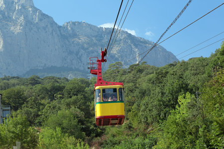 YALTA, REPUBLIC CRIMEA, RUSSIA - AUG 11, 2014: Tourists using the cable car rises to the top of Mount Ai-Petriのeditorial素材