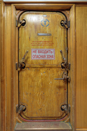 MURMANSK, RUSSIA - FEB 17, 2016: Interior of the Soviet atomic icebreaker "Lenin". The door to the restricted room (danger zone)のeditorial素材