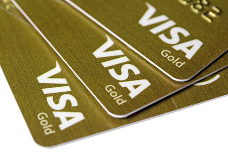 MOSCOW, RUSSIA - OCT 30, 2016: Three gold credit cards Visa on white backgroundのeditorial素材