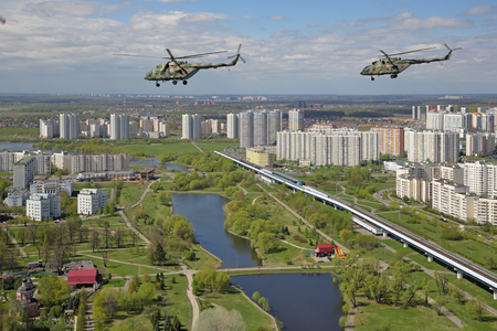MOSCOW, RUSSIA - MAY 07, 2017: A group of Mil Mi-8 helicopters flying over the Yuzhnoye Butovo district to participate in the rehearsal of the passage of aircraft in the parade of Victory Day in WWIIのeditorial素材