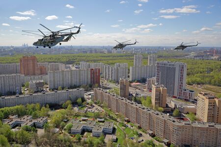 MOSCOW, RUSSIA - MAY 07, 2017: A group of Mil Mi-8 and Mi-26 helicopters fly over the Moscow to participate in the rehearsal of the passage of aircraft in the parade of Victory Day in WWIIのeditorial素材