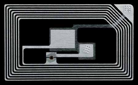 RFID (Radio-frequency identification) tag, isolated on a black background