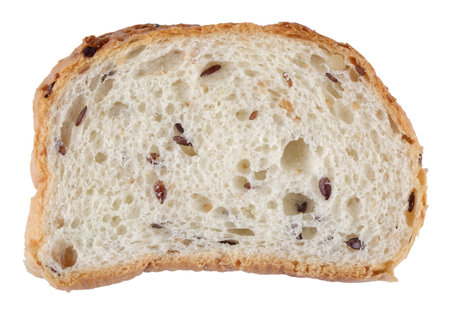 A cut piece of wheat bread with cereals, isolated on a white background