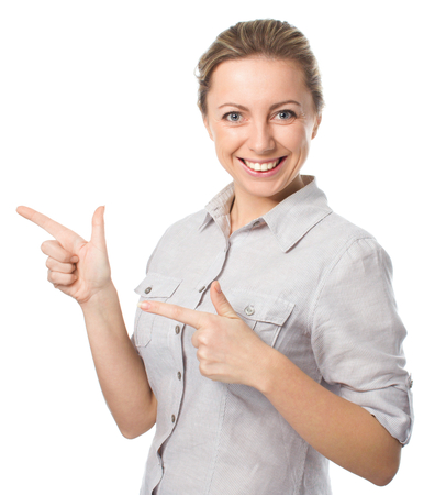 Business woman is pointing aside, isolated on whiteの写真素材