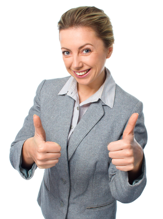 Young businesswoman thumbs up, isolated over whiteの写真素材