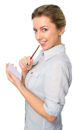 Portrait of  business woman with a notepad, isolated on white backgroundの写真素材