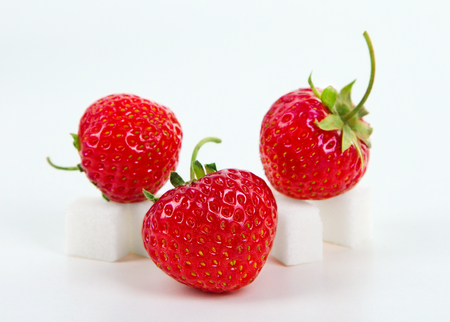 Fresh sweet strawberry on sugar cubeの写真素材