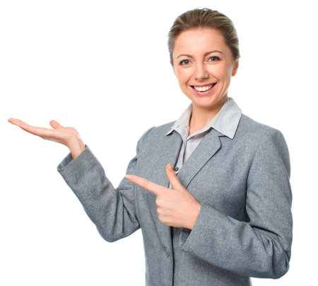 Business woman is pointing aside, isolated on whiteの写真素材