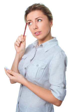 Woman holds pen and notebook isolated over whiteの写真素材