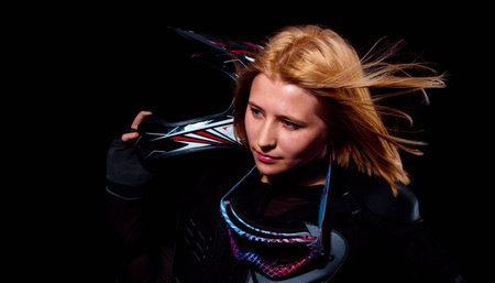 Cyclist girl with helmet on black backgroundの写真素材