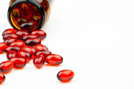 Red gel medical capsules, isolated on white background.の写真素材