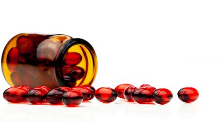 Red gel medical capsules, isolated on white background.の写真素材