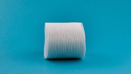 Q-tips, cotton swabs, cotton pads, isolated on bright blue background.の写真素材